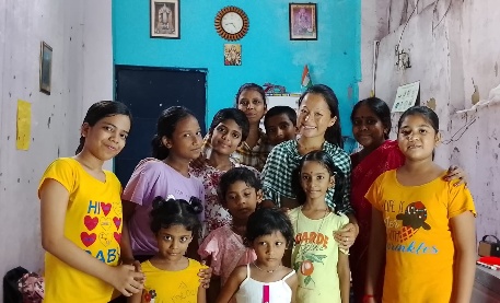 Group of MKSS students and teachers posing together at a learning centre